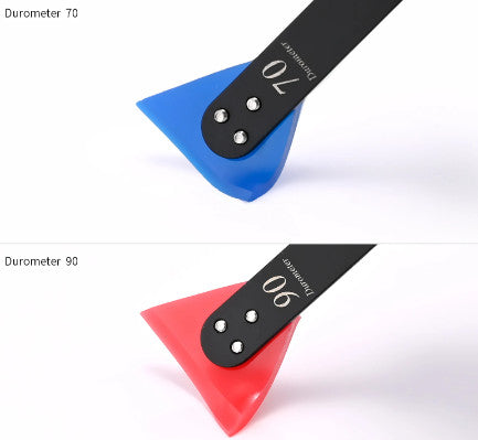 Dual Head Slim Squeegee displaying its dual-color blades, red for hard surfaces and blue for softer applications. 70 Durometer and 90 Durometer