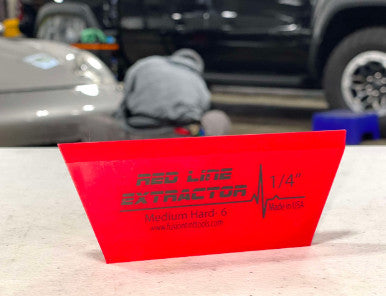 Close-up of the Red Line Extractor Blade’s single bevel edge, highlighting its precision and quality for installation tasks.