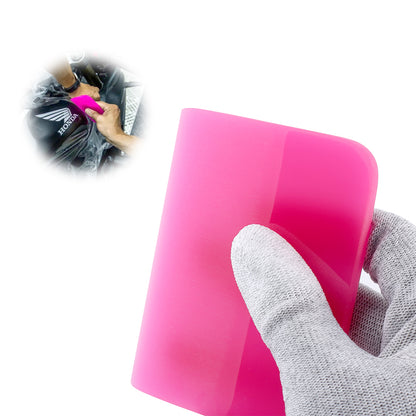 Professional using a pink round edge squeegee, highlighting its precision and ease of use on various surfaces.