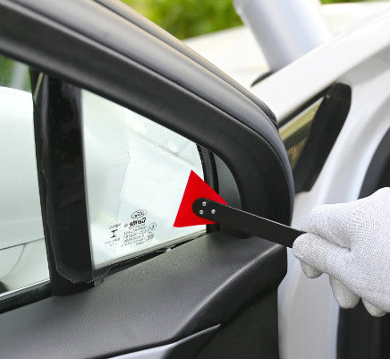 Action shot of the Dual Head Slim Squeegee in use on a car window, demonstrating effective film application.
