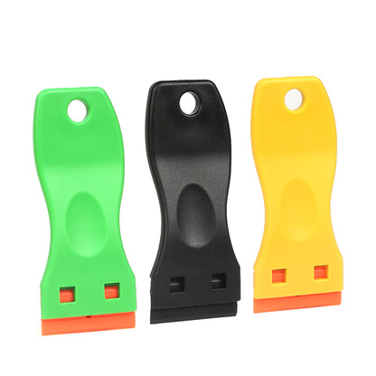 Set of Plastic 1-Inch Blade Holders in black, green, and yellow, demonstrating the range of options available