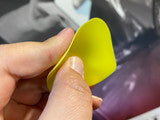 Close-up of the Lidco Soft Yellow Chizzler, showcasing its precise edge for film correction.